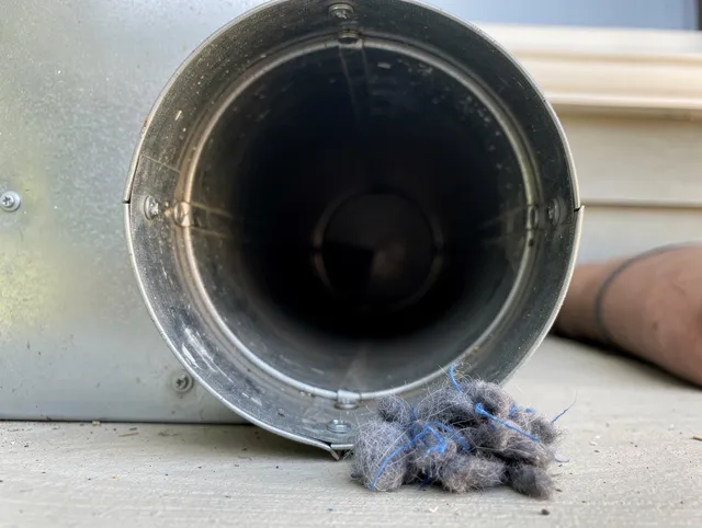 Carson Dryer Vent Cleaning technician using specialized equipment to clear severe dryer vent blockage in Carson